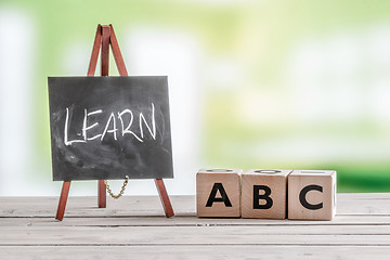 Image showing Blackboard and cubes with alphabet