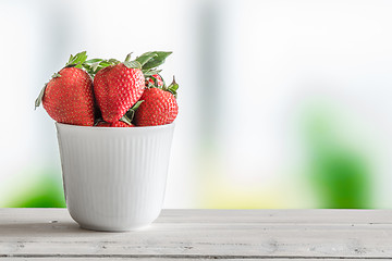 Image showing Strawberries in a white cup