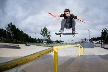Image showing Skateboarder doing a ollie