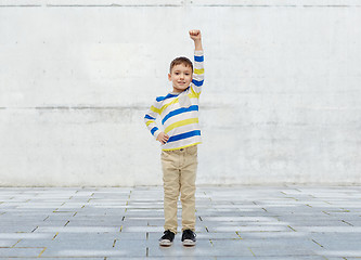 Image showing happy smiling little boy with raised hand