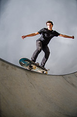 Image showing Skateboarder doing a grind