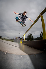 Image showing Skateboarder doing a ollie