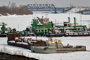 Image showing pump-dredge and boats on winter parking