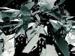 Image showing Destructed glass pieces isolated on black shallow DOF