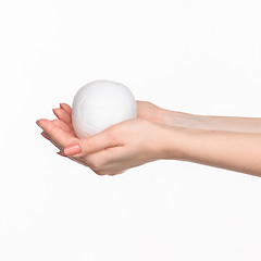 Image showing Hands holding a egg on white background