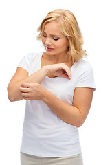 Image showing unhappy woman suffering from hand inch