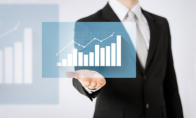 Image showing close up of man hand showing diagram chart