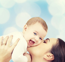 Image showing laughing baby playing with mother