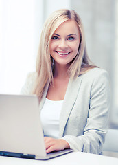 Image showing businesswoman with laptop in office