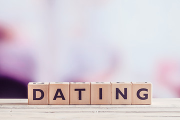 Image showing Dating sign in wood on a table