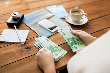 Image showing close up of traveler hands counting euro money