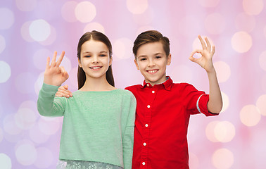 Image showing happy boy and girl showing ok hand sign