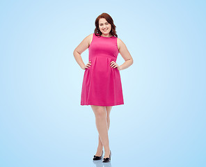 Image showing happy young plus size woman posing in pink dress