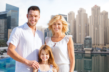 Image showing happy family over dubai city background