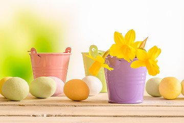 Image showing Easter eggs and flowerpots with daffodils