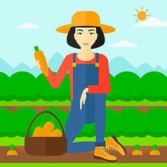 Image showing Farmer collecting carrots.