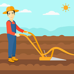 Image showing Farmer on the field with plough.