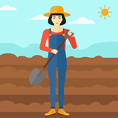 Image showing Farmer on the field with shovel.