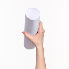 Image showing The cylinder female hands on white background