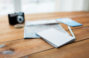 Image showing close up of notepad with map and travel tickets