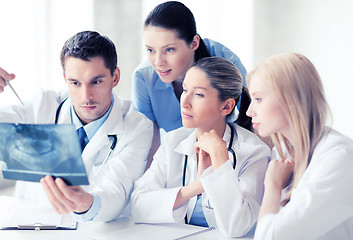 Image showing group of doctors looking at x-ray