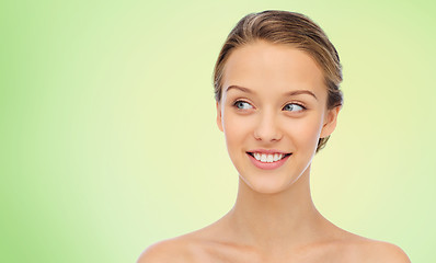 Image showing smiling young woman face and shoulders