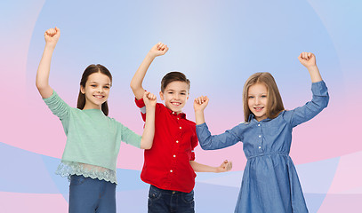 Image showing happy boy and girls celebrating victory