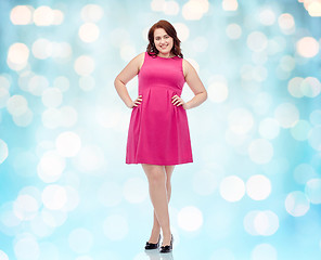 Image showing happy young plus size woman posing in pink dress