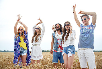 Image showing happy young hippie friends dancing outdoors