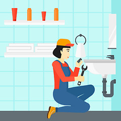 Image showing Woman repairing sink.