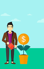 Image showing Man watering money flower.