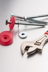 Image showing Spanner tool and screws