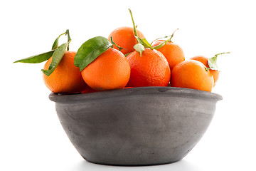 Image showing Tangerines on clay bowl 