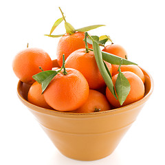 Image showing Tangerines on ceramic yellow bowl 