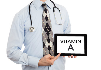 Image showing Doctor holding tablet - Vitamin A