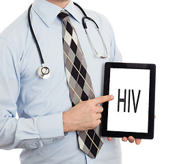 Image showing Doctor holding tablet - HIV