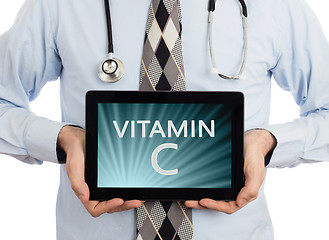 Image showing Doctor holding tablet - Vitamin C