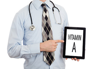 Image showing Doctor holding tablet - Vitamin A