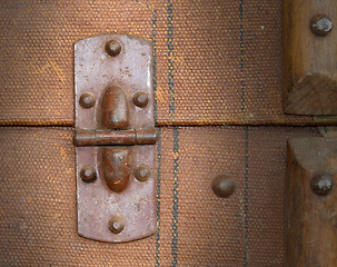 Image showing Old canvas trunk hinge close up