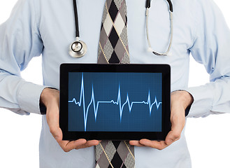 Image showing Doctor holding tablet - Heartbeat graph