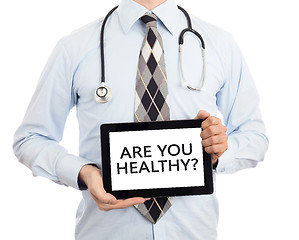 Image showing Doctor holding tablet - Are you healthy?