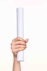 Image showing The cylinder female hands on white background