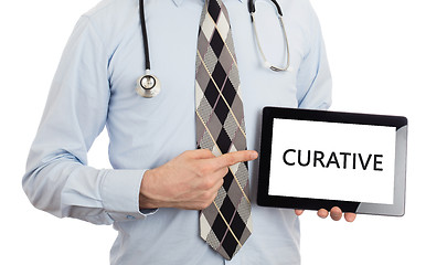 Image showing Doctor holding tablet - Curative