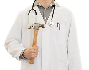 Image showing Crazy doctor is holding a big hammer in his hands