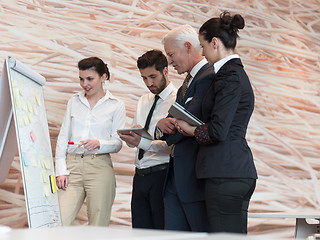 Image showing businesswoman presenting ideas and projects on white board