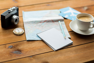 Image showing close up of notepad with map and travel tickets