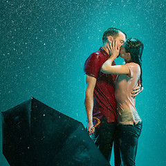 Image showing The loving couple in the rain