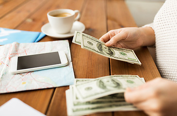 Image showing close up of traveler hands counting dollar money