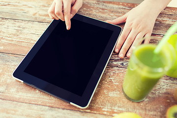 Image showing close up of woman hands tablet pc and fruit juice