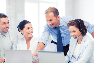 Image showing group of people working in call center